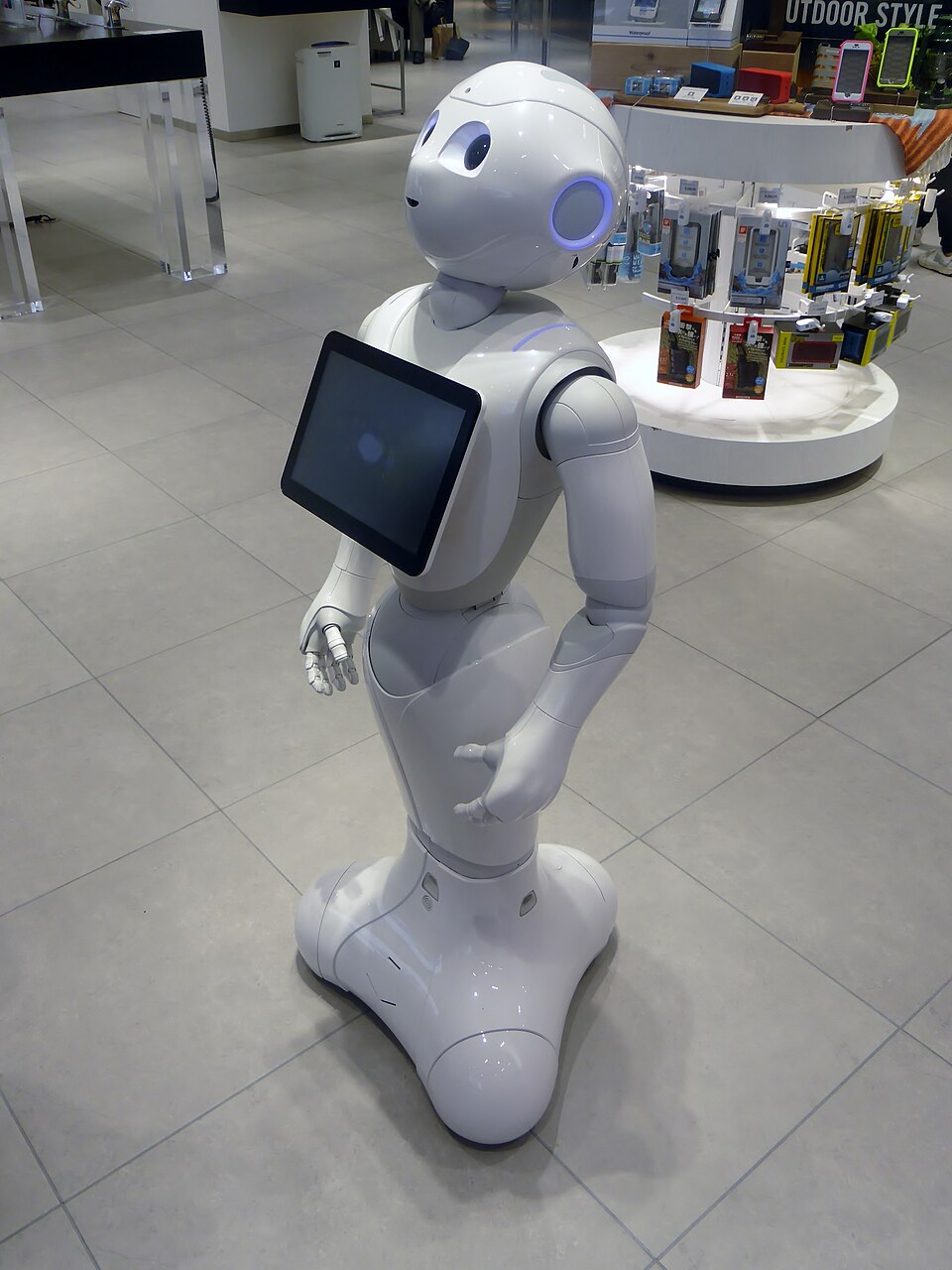 White Pepper robot with a chest-mounted tablet and wheeled base in a store