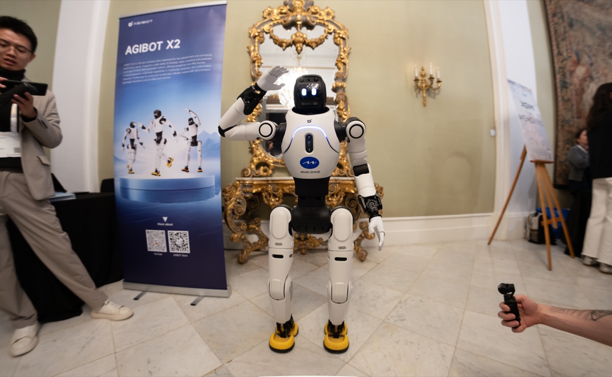 AgiBot X2 humanoid robot standing at a trade show booth