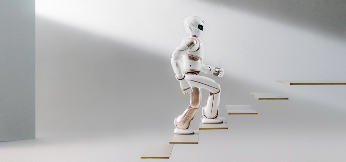 White UBTECH Walker X humanoid robot climbing stairs