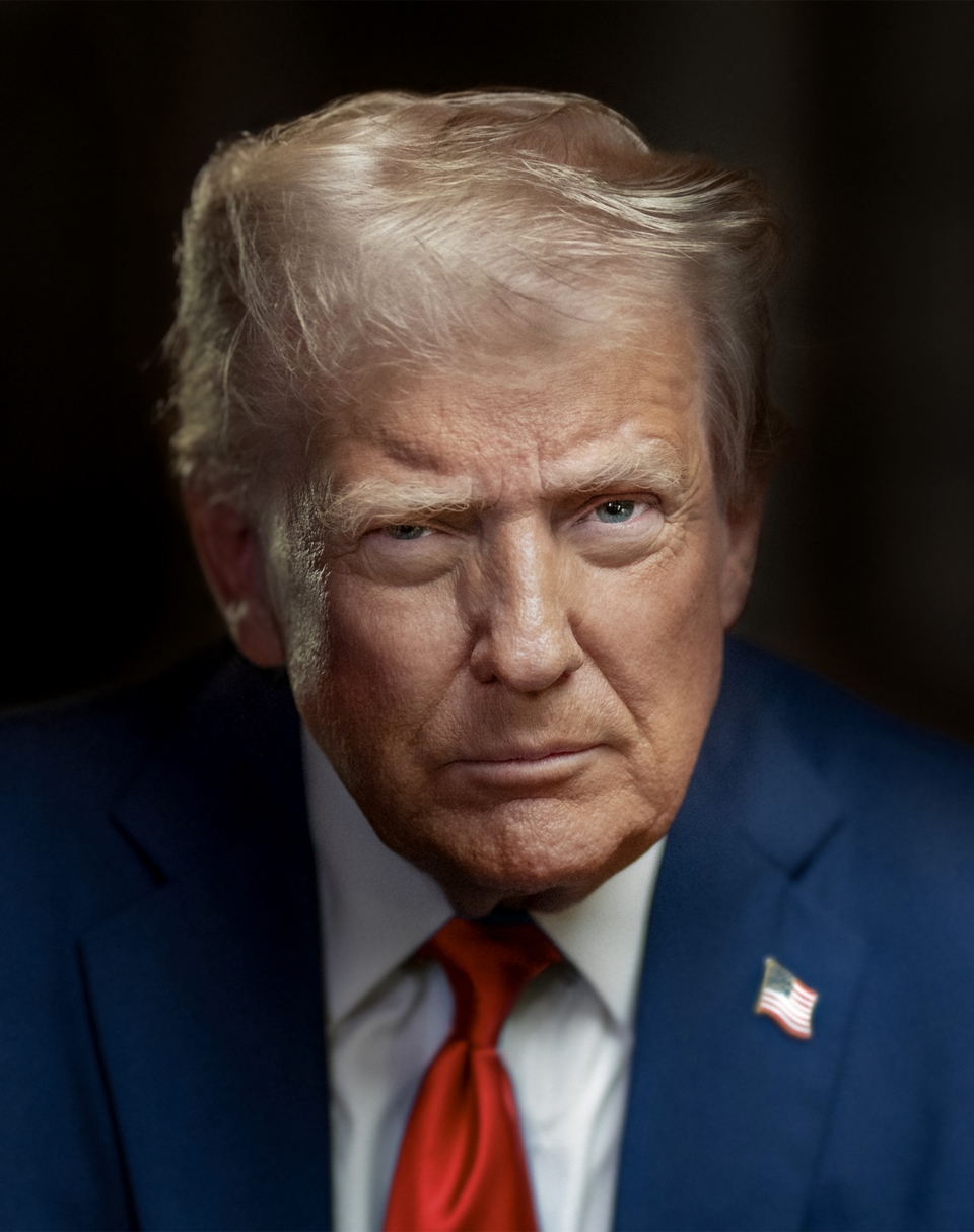 Donald Trump wearing a navy suit, white shirt and red tie against a dark background